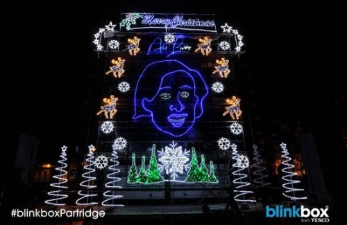 Alan Partridge’s giant neon face lights up Norwich for Christmas